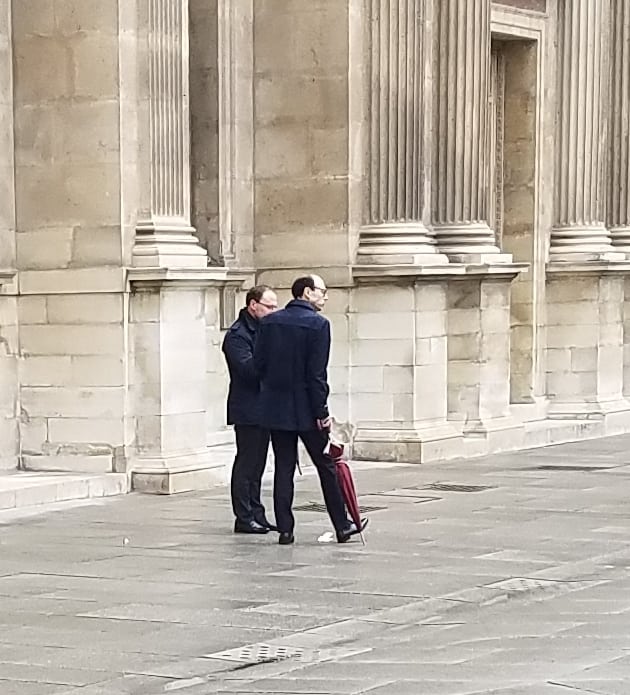 men's style in france with umbrellas