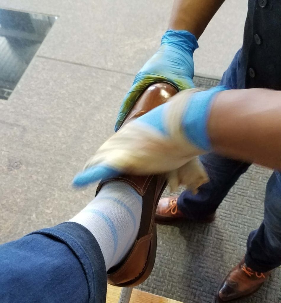 amando at work at the shoe care company