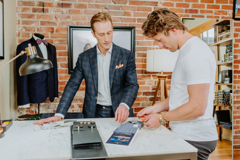 Selecting fabrics at a local custom clothier