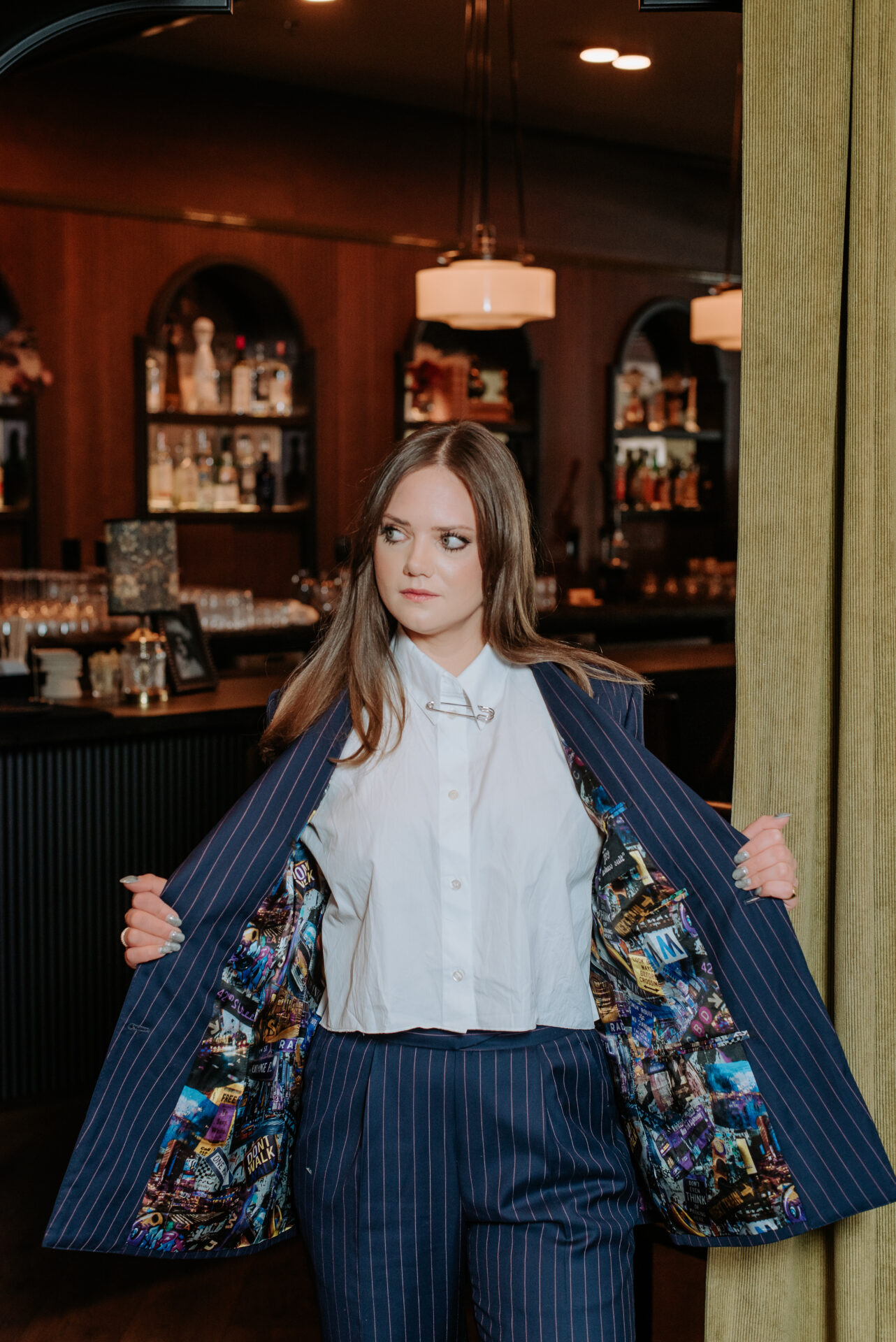 Woman showing custom suit lining