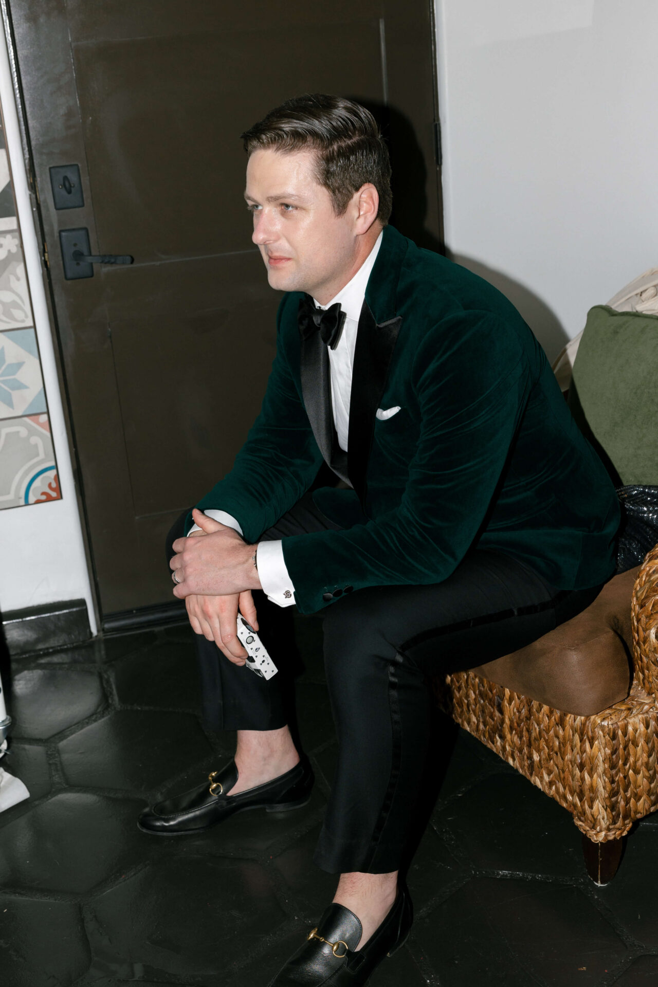 man sitting in velvet jacket